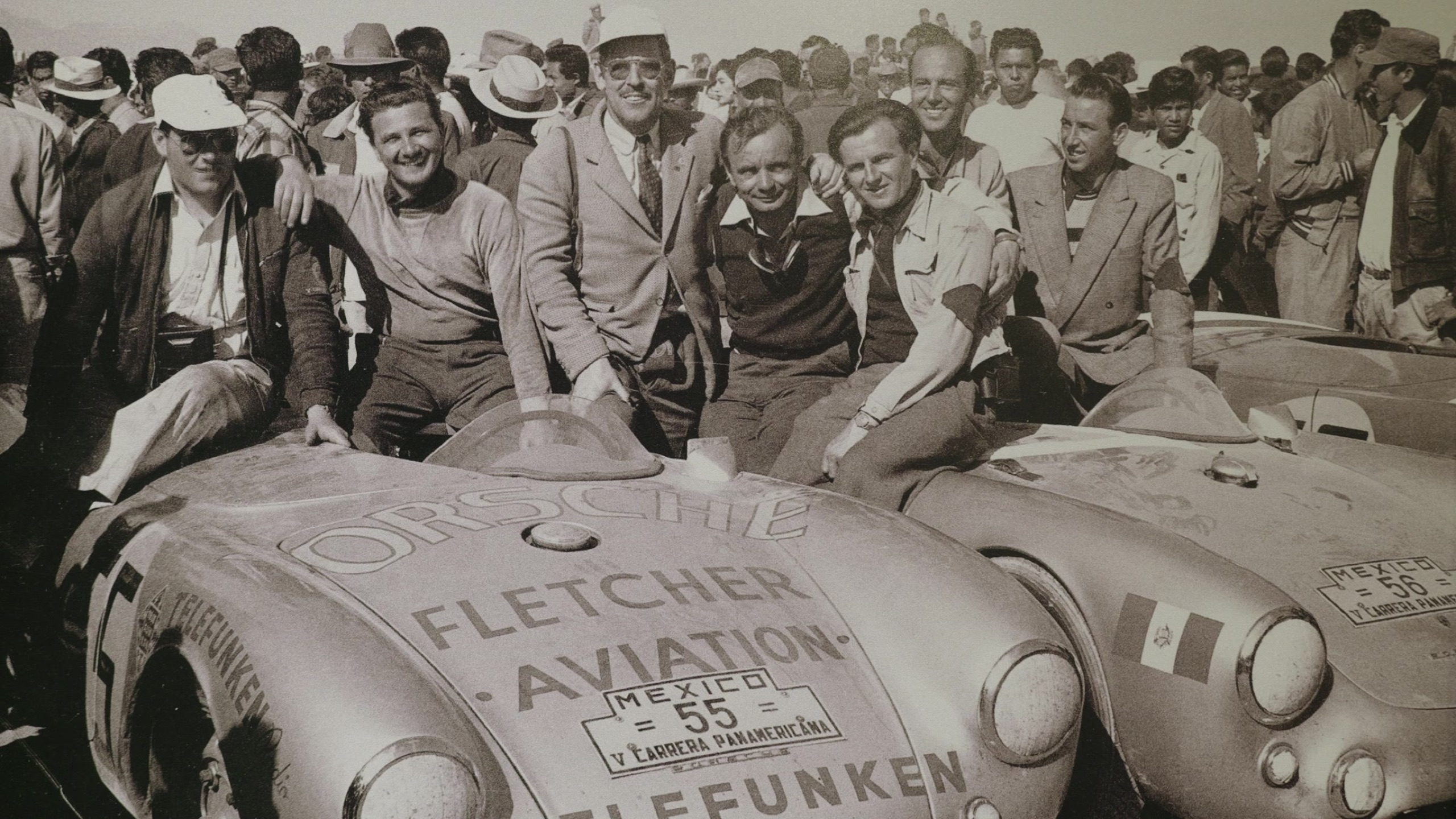 Archival black-and-white racing photograph on display