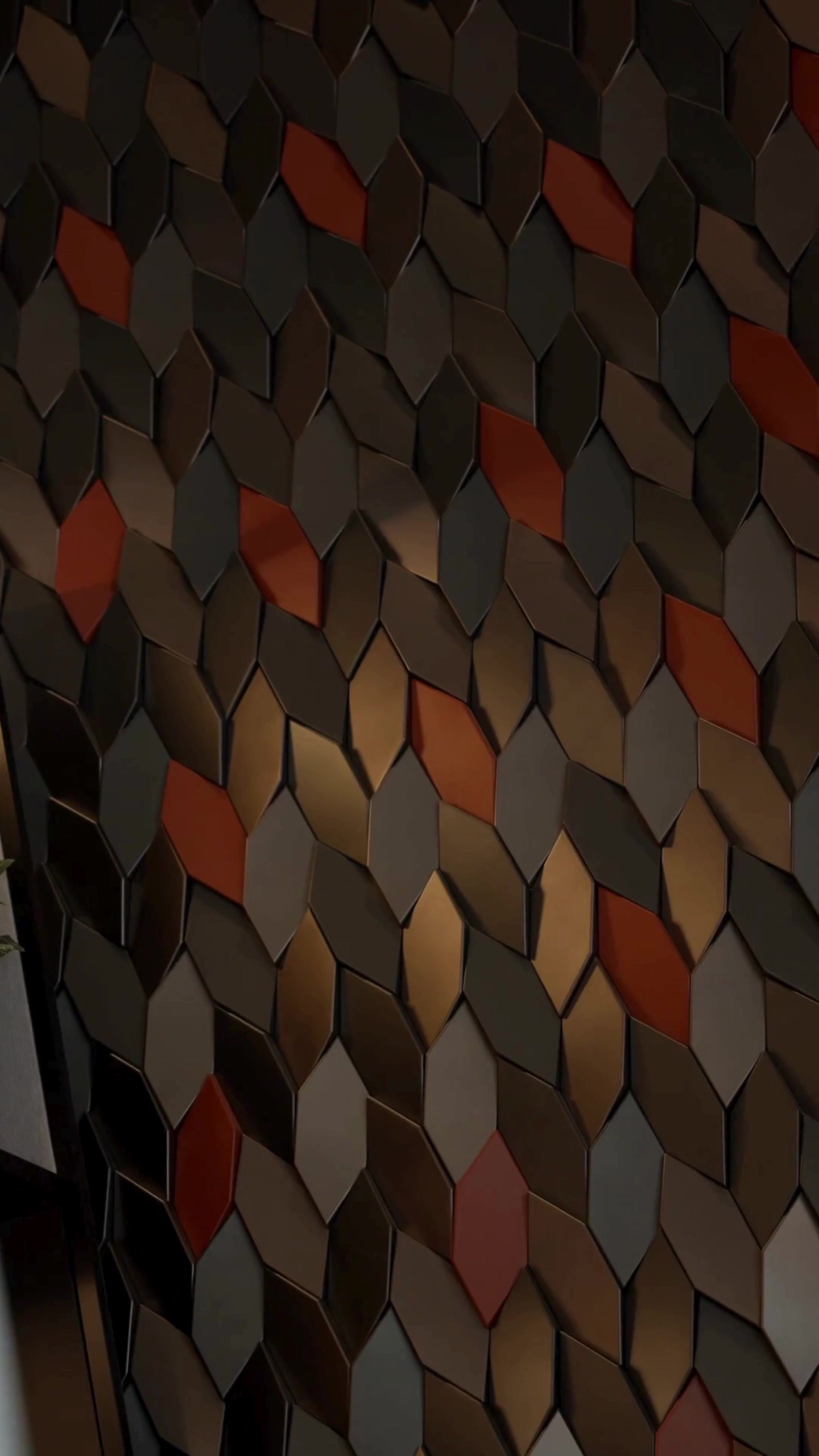 Textured wall of hexagonal tiles inside the studio