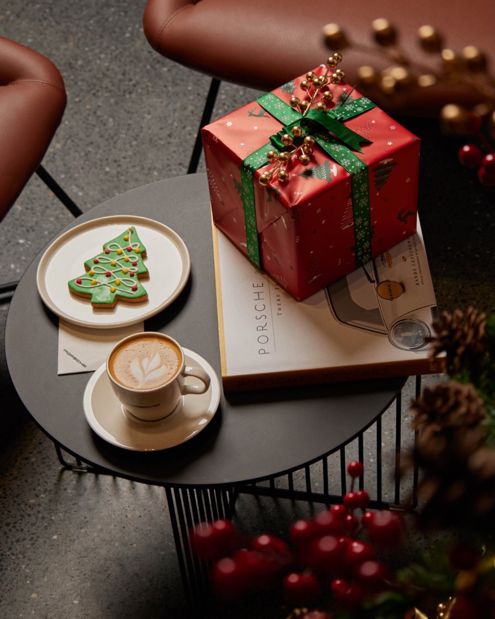 Coffee, cookies and a wrapped gift styled on a table