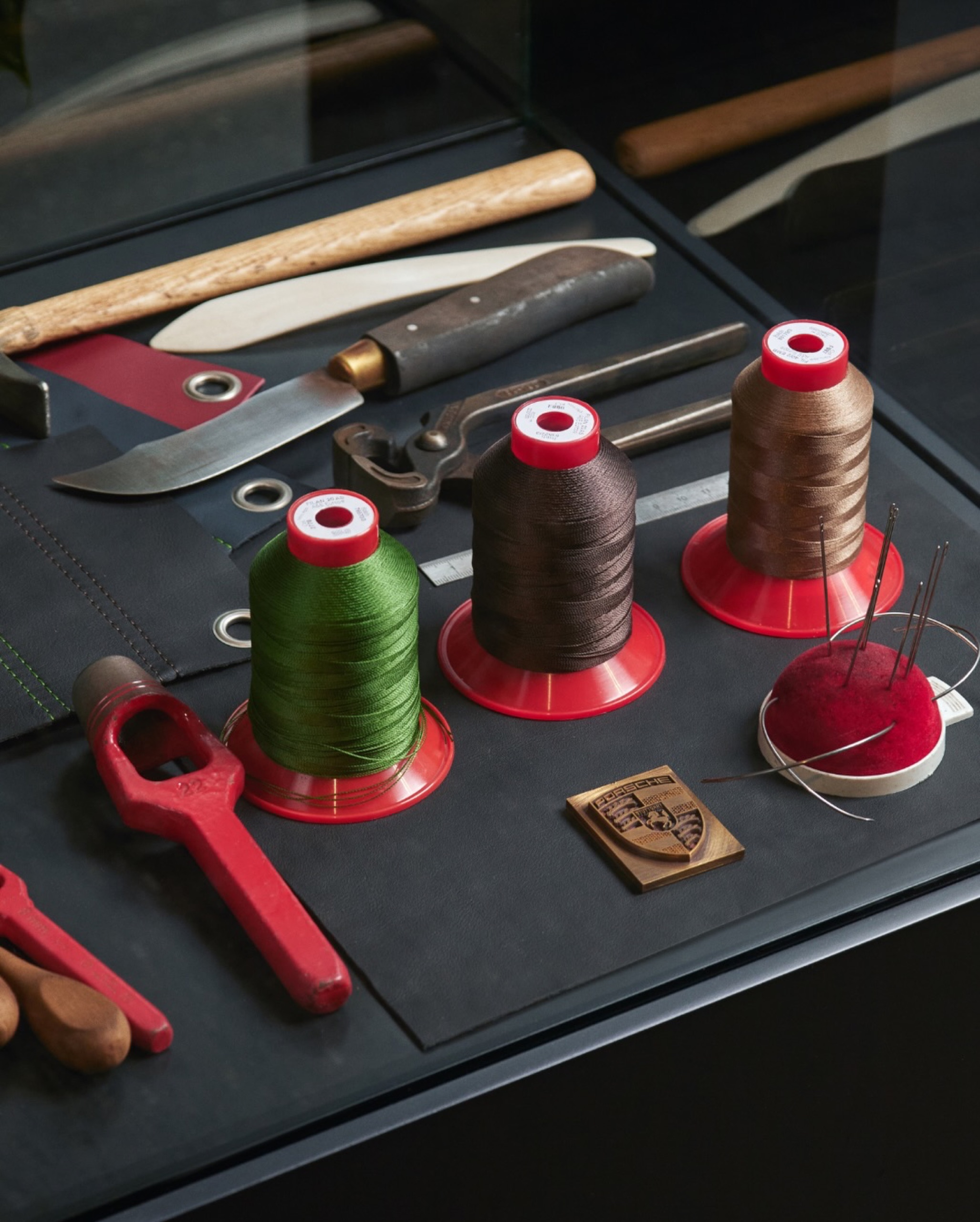 Leather samples, threads and tools from Porsche Exclusive Manufaktur