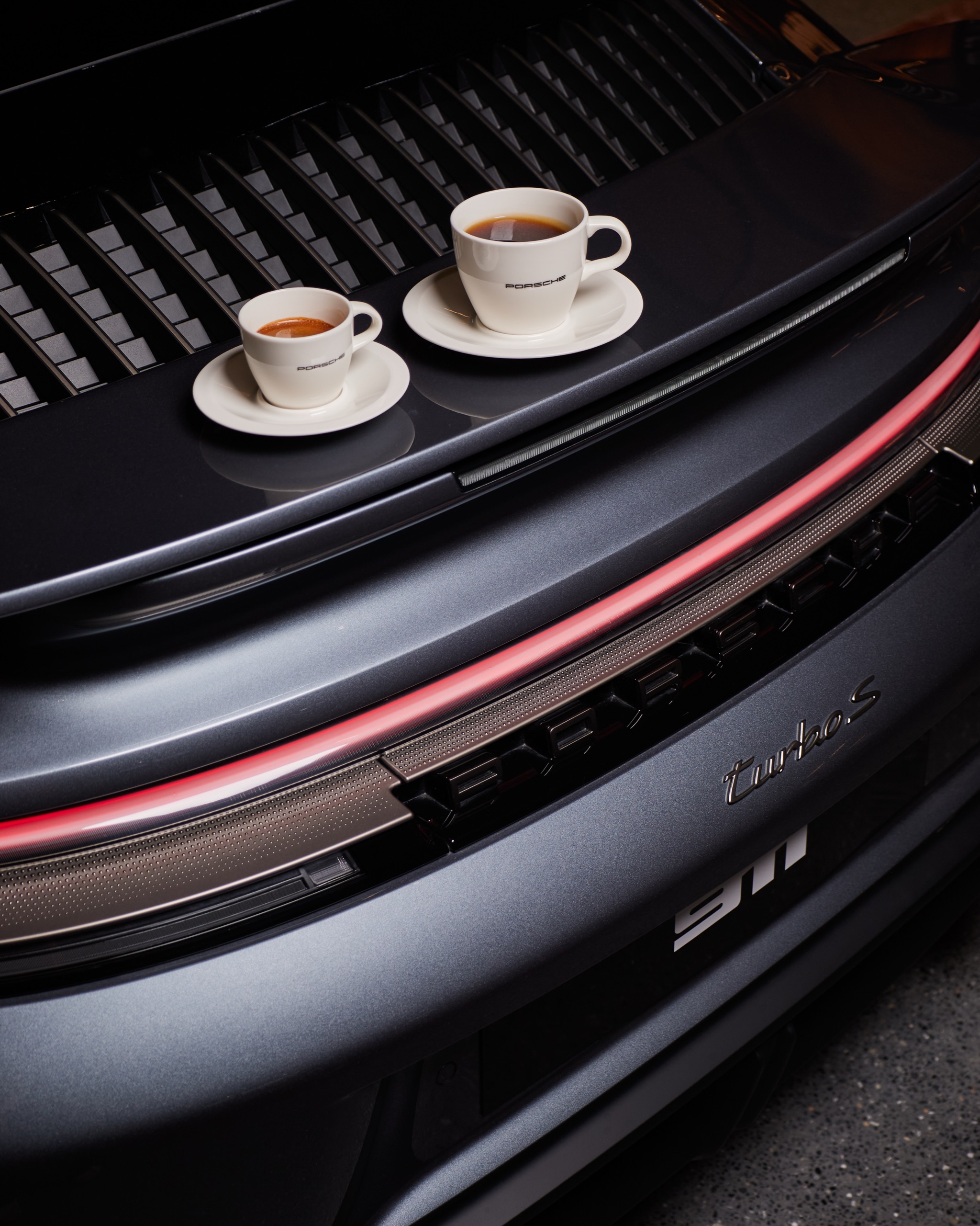 Two espresso cups styled on the rear of a 911
