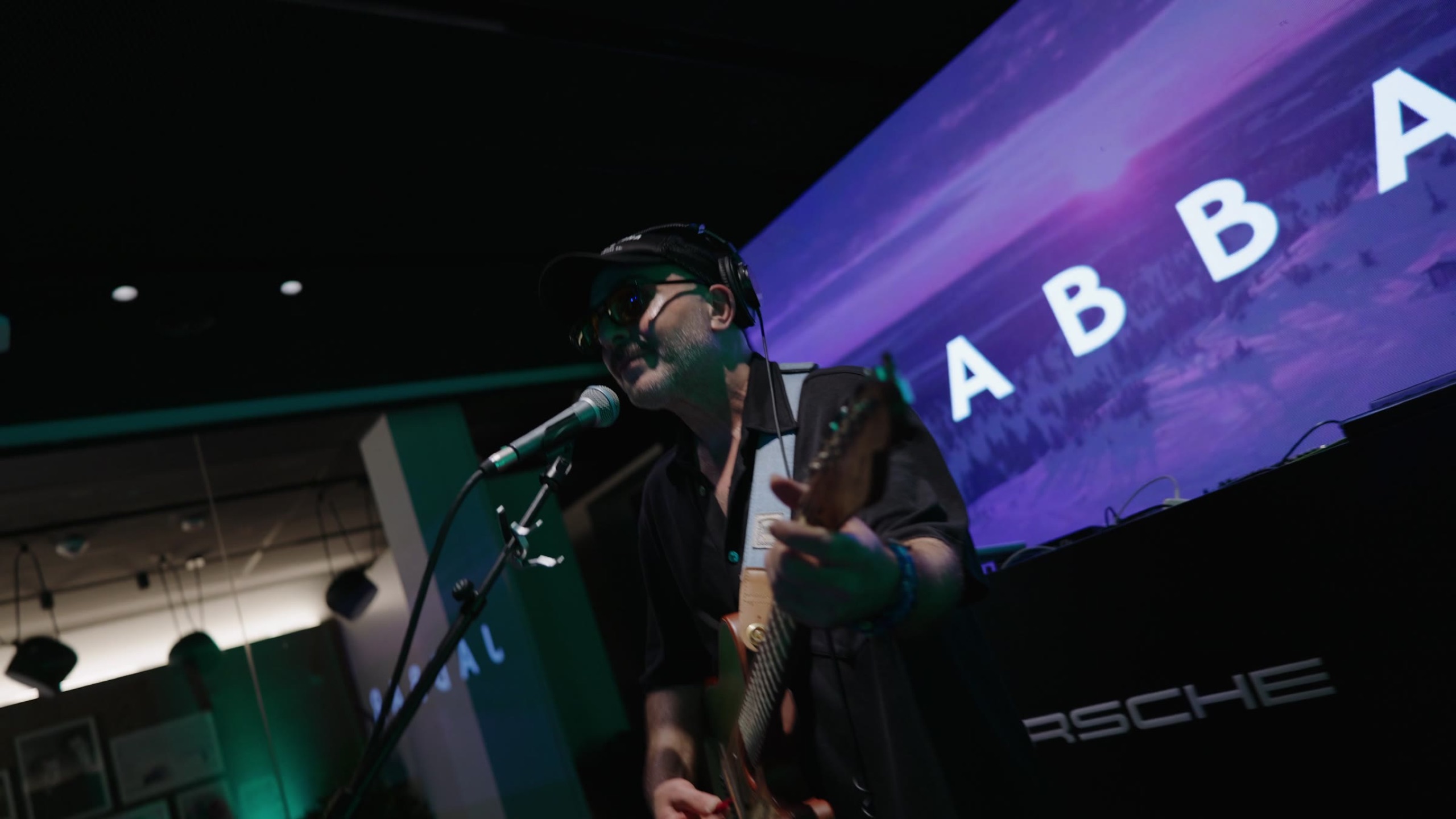 Live band performing in front of the projection screen