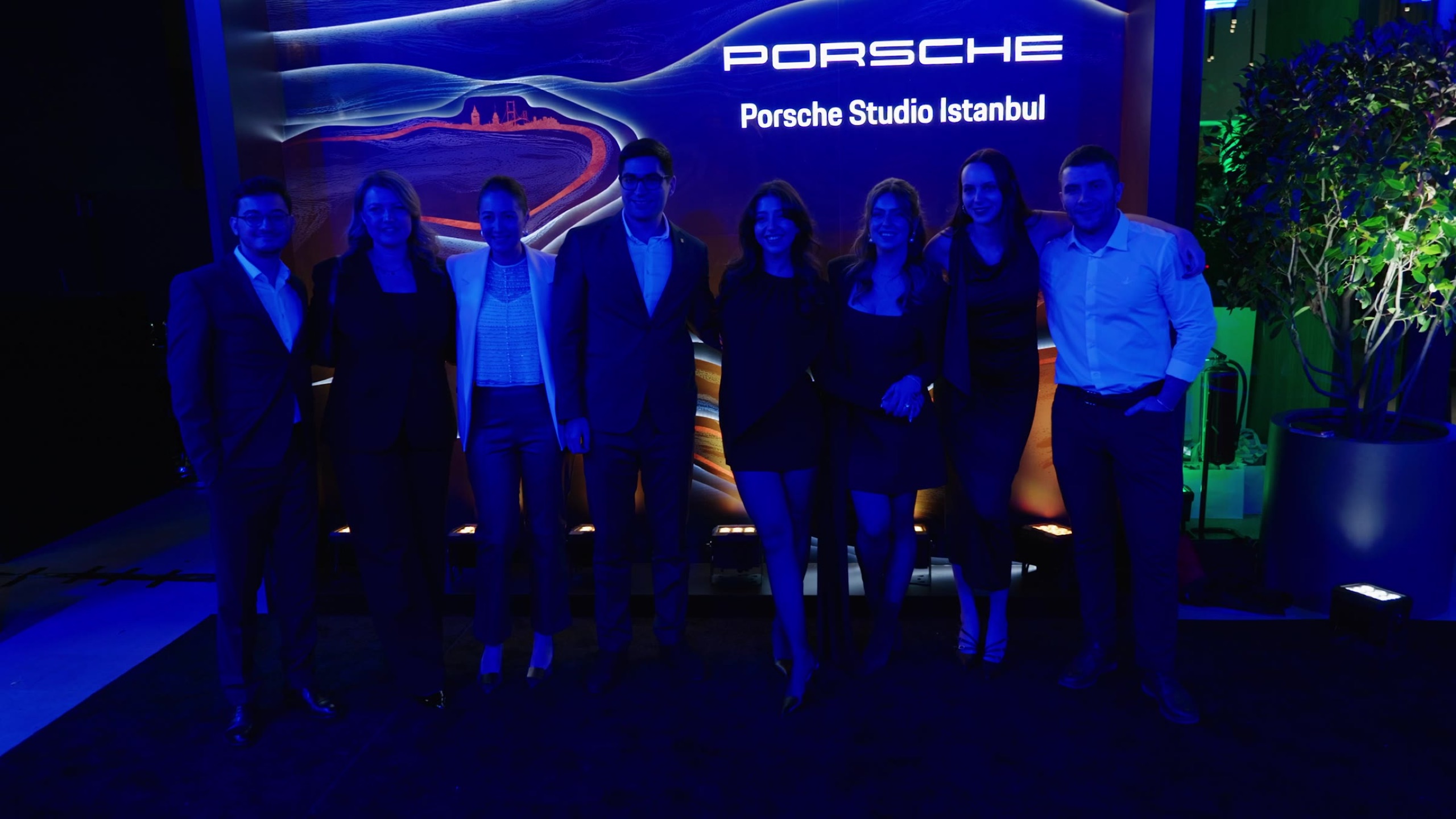 The Porsche Studio Istanbul team together in front of the stage